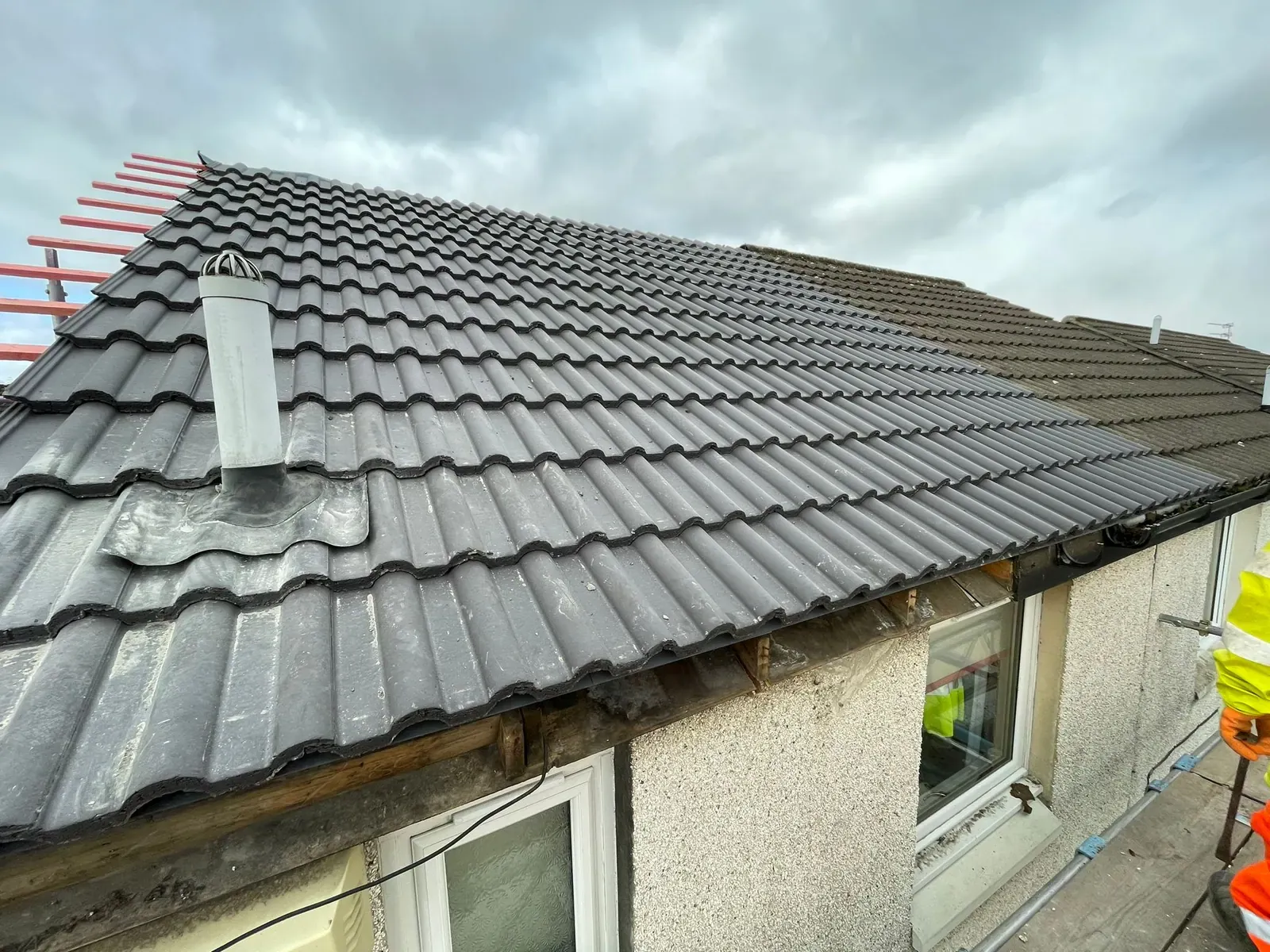 Completed grey tiled roof with new chimney lead work in Falkirk